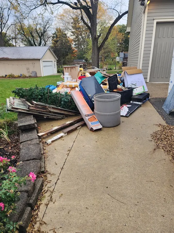 Dumpster being loaded with debris for Residential Dumpster Rental in Overisel